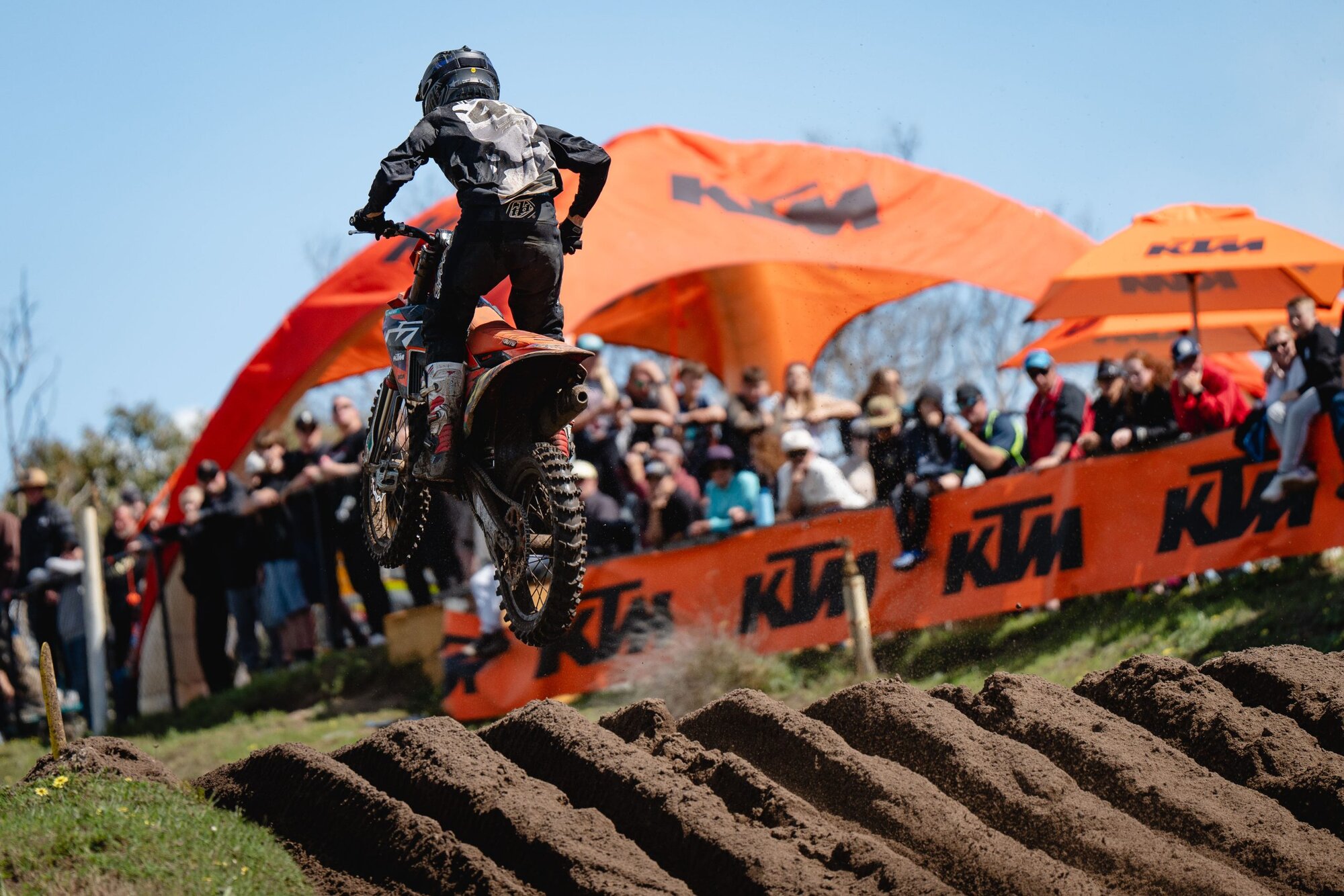02-ktm-jump Junior rider mid-air at the 2026 AJMX Championships track prepared by Protraxx