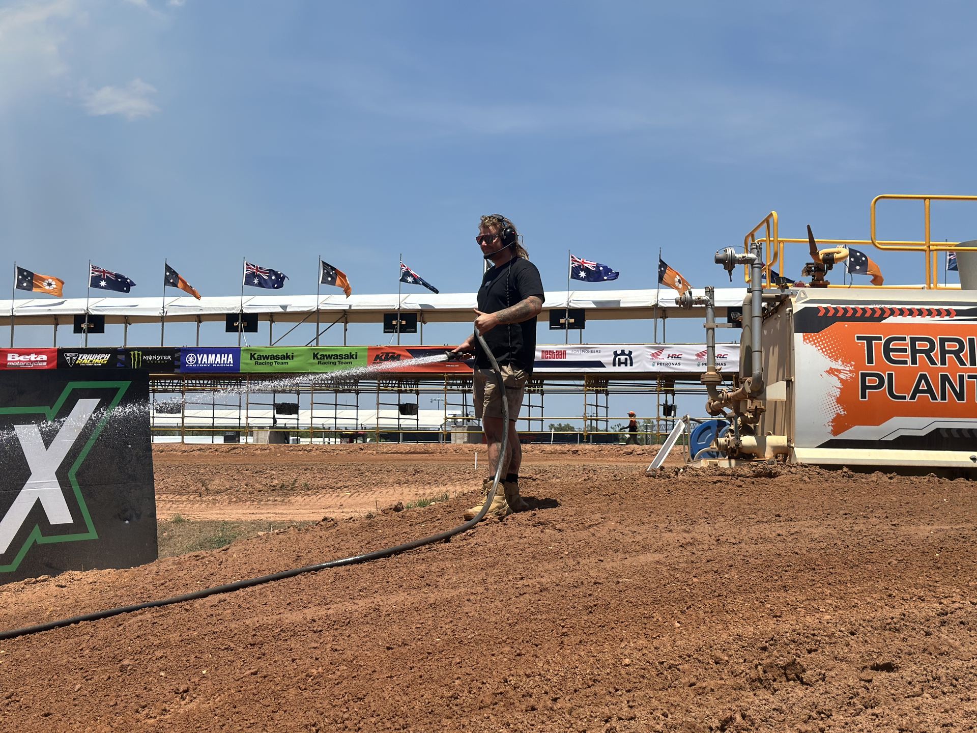 Protraxx crew member hand-watering the MXGP Darwin track Protraxx crew member hand-watering the MXGP Darwin track