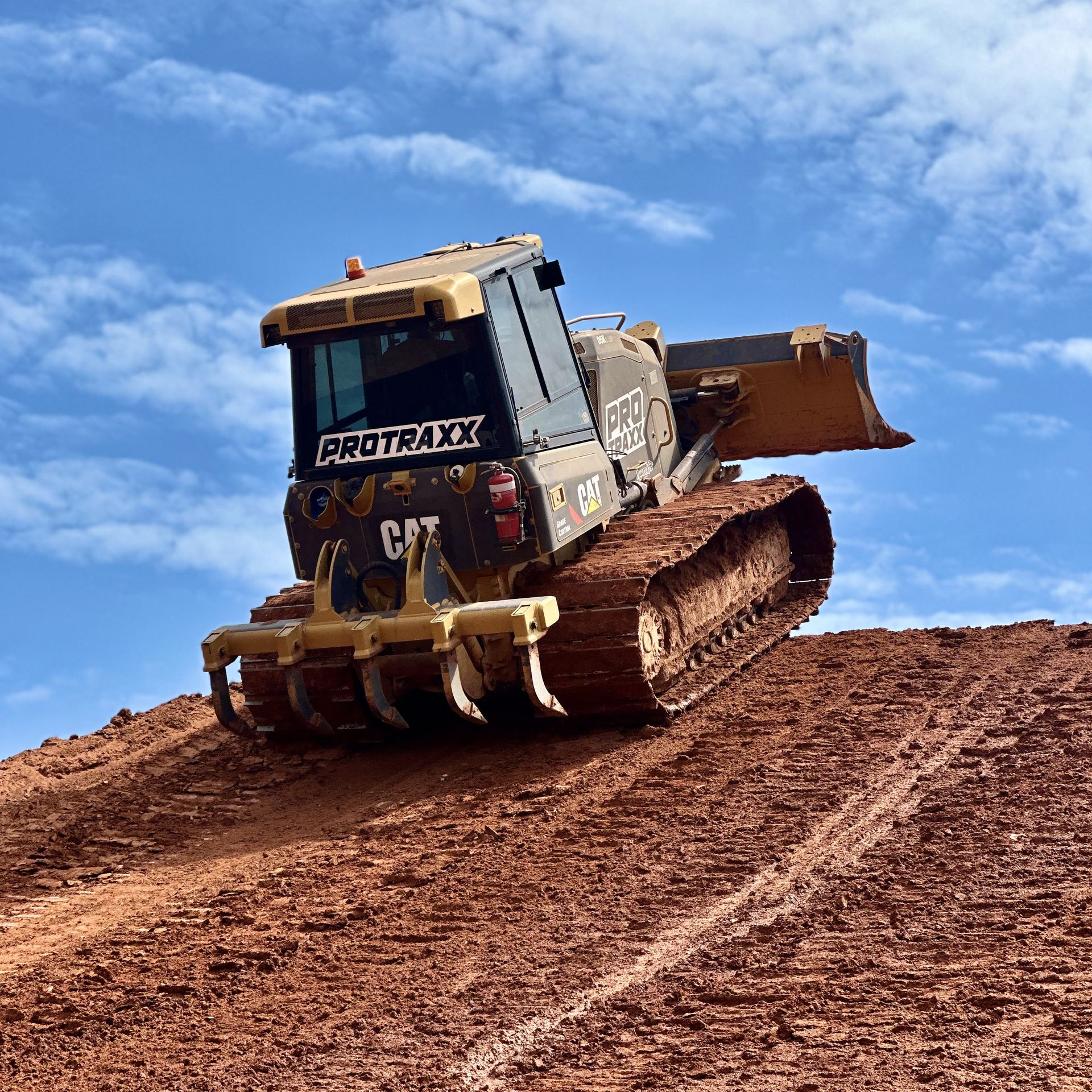 Protraxx dozer climbing a jump at the Hidden Valley MXGP track Protraxx dozer climbing a jump at the Hidden Valley MXGP track